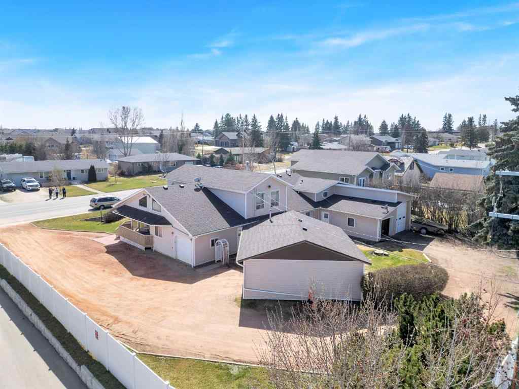 MLS® A2213994 - 4718 College Avenue  in College Heights Lacombe, Multi-Family