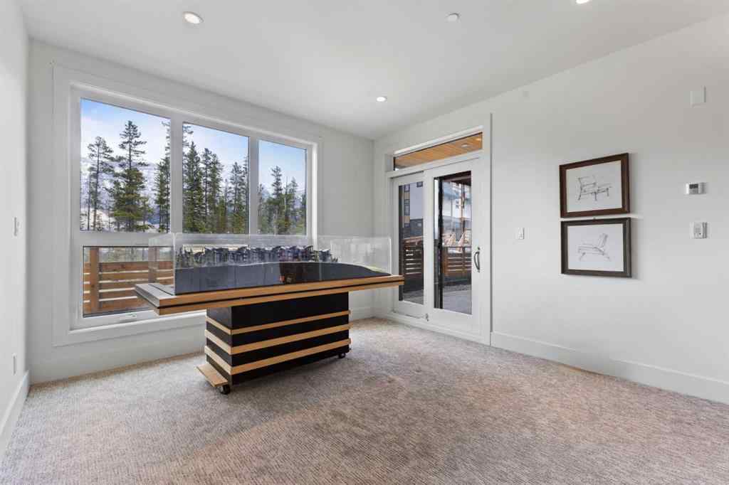MLS® A2214279 - Unit #102 101A Stewart Creek Rise  in Three Sisters Canmore, Residential