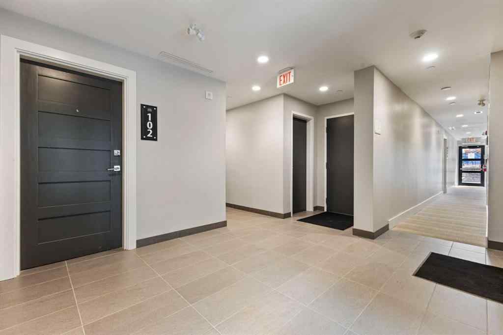 MLS® A2214279 - Unit #102 101A Stewart Creek Rise  in Three Sisters Canmore, Residential