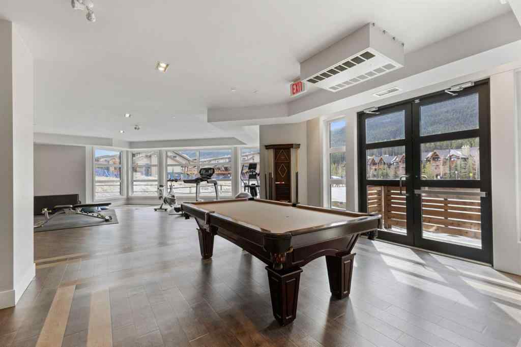 MLS® A2214279 - Unit #102 101A Stewart Creek Rise  in Three Sisters Canmore, Residential