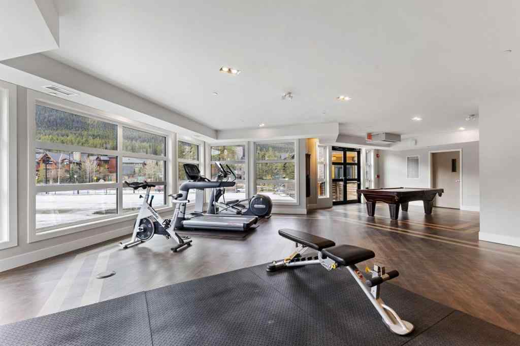 MLS® A2214279 - Unit #102 101A Stewart Creek Rise  in Three Sisters Canmore, Residential