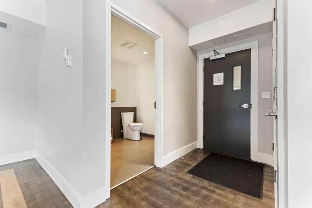 MLS® A2214279 - Unit #102 101A Stewart Creek Rise  in Three Sisters Canmore, Residential