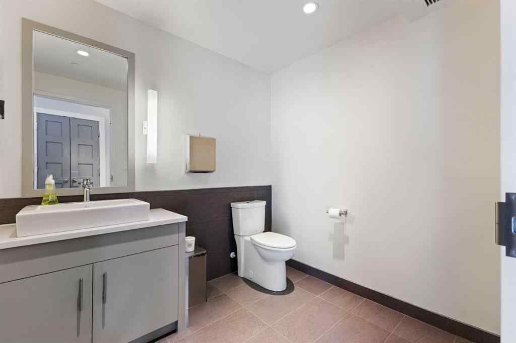 MLS® A2214279 - Unit #102 101A Stewart Creek Rise  in Three Sisters Canmore, Residential