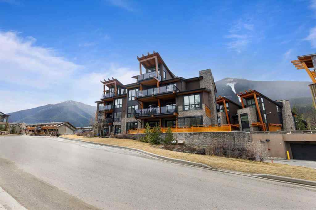 MLS® A2214279 - Unit #102 101A Stewart Creek Rise  in Three Sisters Canmore, Residential