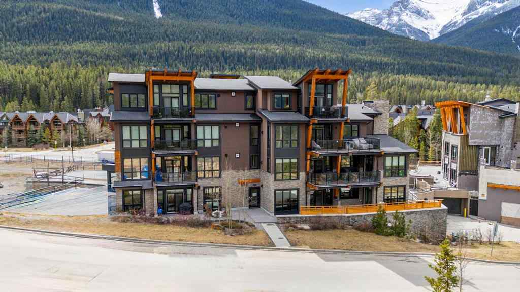 MLS® A2214279 - Unit #102 101A Stewart Creek Rise  in Three Sisters Canmore, Residential