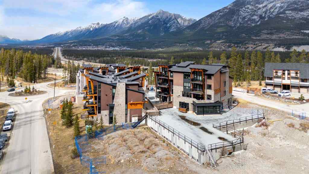 MLS® A2214279 - Unit #102 101A Stewart Creek Rise  in Three Sisters Canmore, Residential