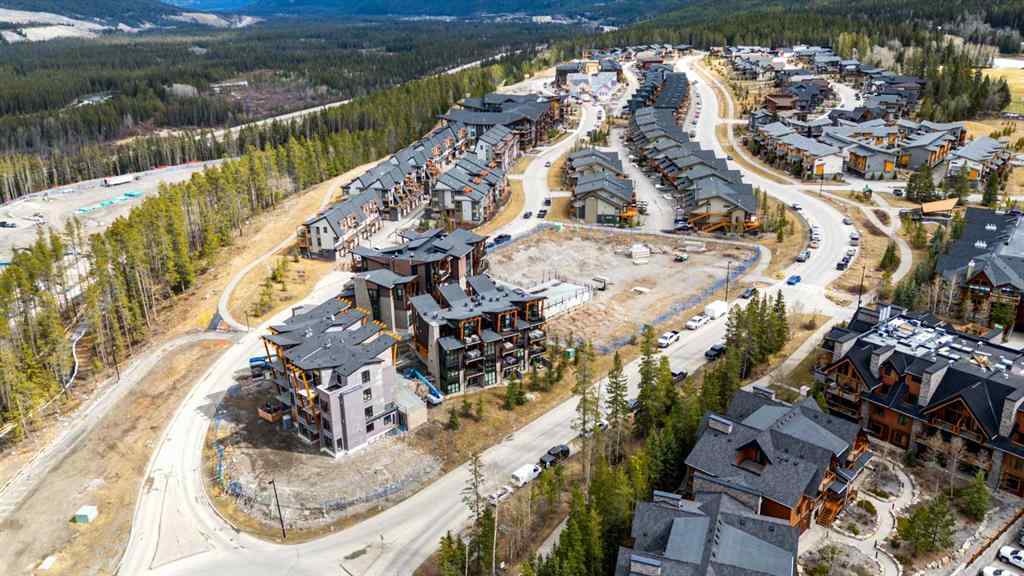 MLS® A2214279 - Unit #102 101A Stewart Creek Rise  in Three Sisters Canmore, Residential