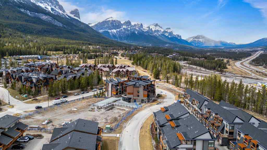 MLS® A2214279 - Unit #102 101A Stewart Creek Rise  in Three Sisters Canmore, Residential