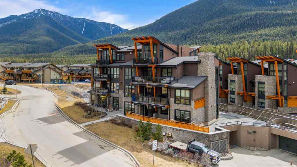 MLS® A2214279 - Unit #102 101A Stewart Creek Rise  in Three Sisters Canmore, Residential