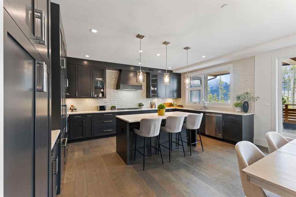 MLS® A2214279 - Unit #102 101A Stewart Creek Rise  in Three Sisters Canmore, Residential