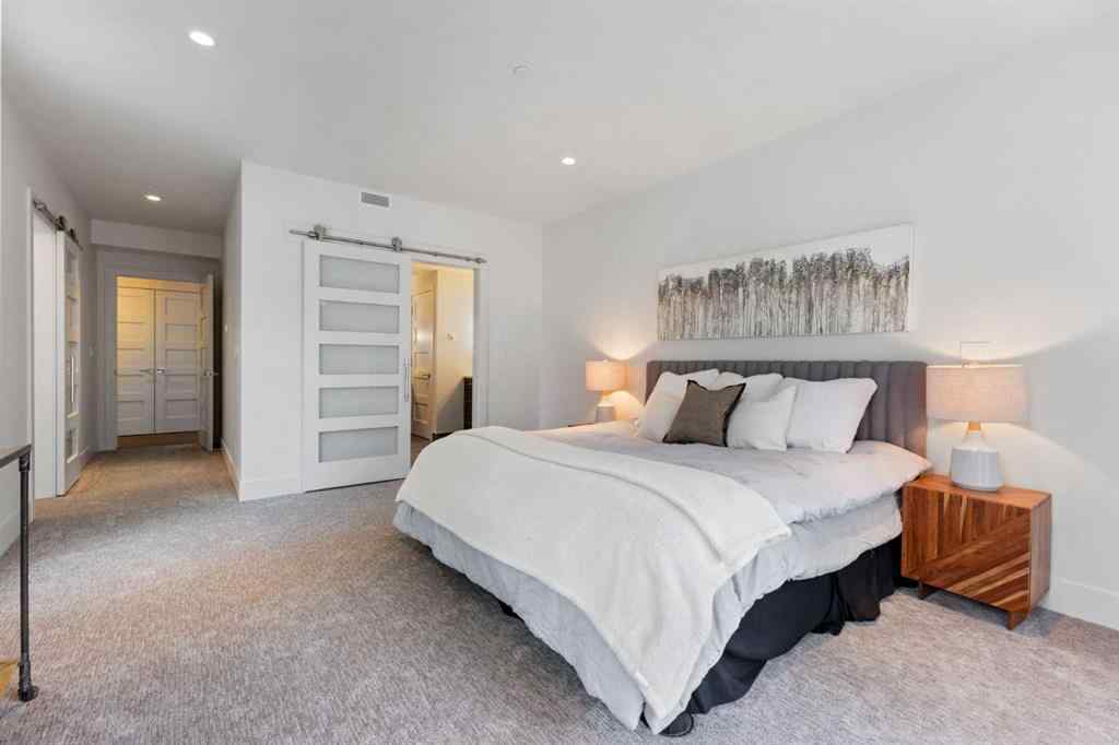 MLS® A2214279 - Unit #102 101A Stewart Creek Rise  in Three Sisters Canmore, Residential