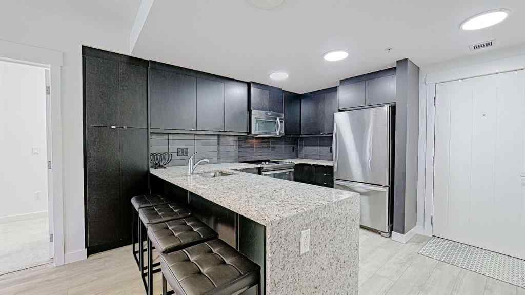 MLS® A2214621 - Unit #122 15 Aspenmont Heights SW in Aspen Woods Calgary, Residential