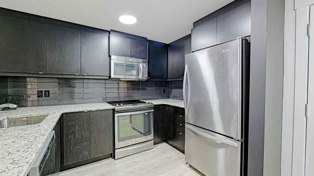 MLS® A2214621 - Unit #122 15 Aspenmont Heights SW in Aspen Woods Calgary, Residential