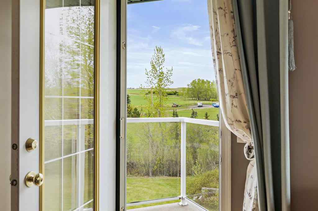 MLS® A2215495 - Unit #200 243121 16 Street E in NONE Rural Foothills County, Residential