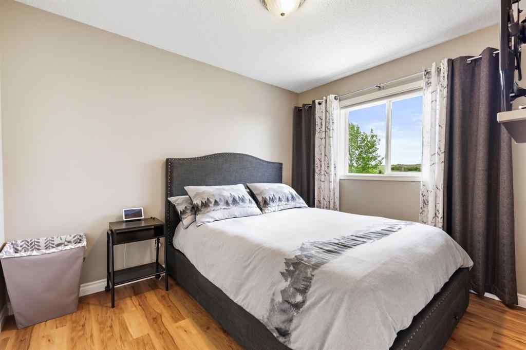 MLS® A2215495 - Unit #200 243121 16 Street E in NONE Rural Foothills County, Residential
