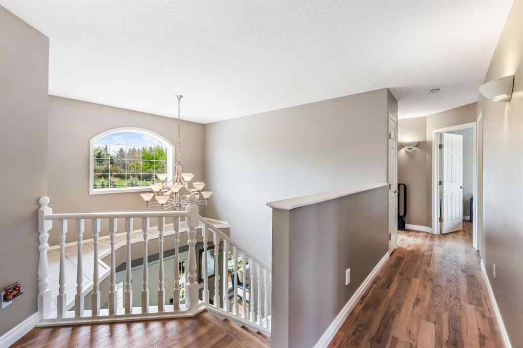 MLS® A2215495 - Unit #200 243121 16 Street E in NONE Rural Foothills County, Residential