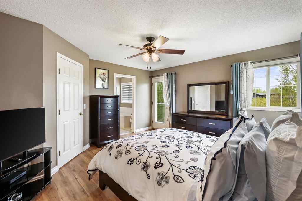 MLS® A2215495 - Unit #200 243121 16 Street E in NONE Rural Foothills County, Residential