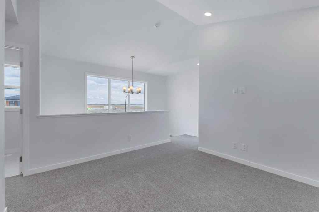 MLS® A2215565 - 143 Herron Walk NE in Livingston Calgary, Residential