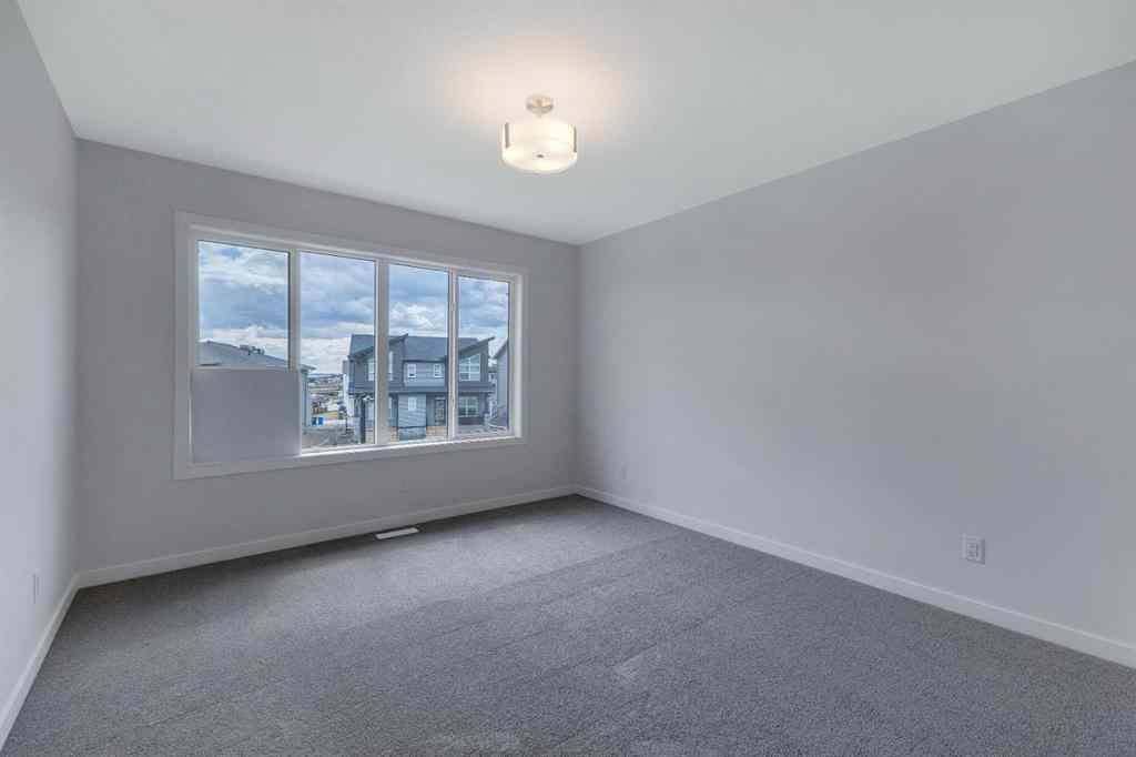MLS® A2215565 - 143 Herron Walk NE in Livingston Calgary, Residential