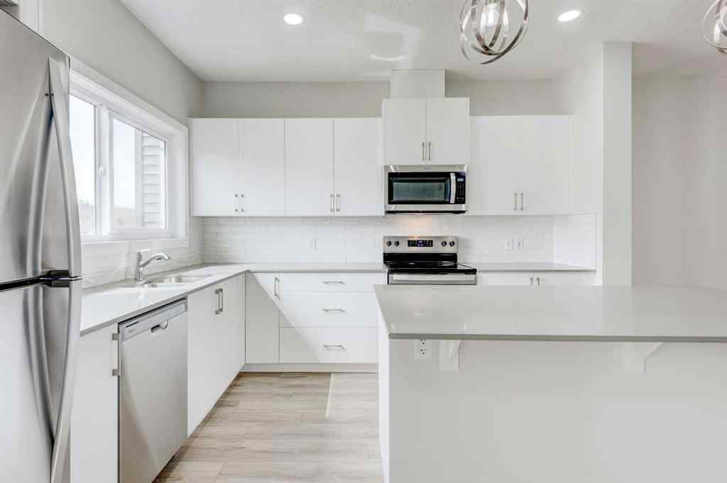MLS® A2215819 - 166 Creekview Gardens SW in Pine Creek Calgary, Residential