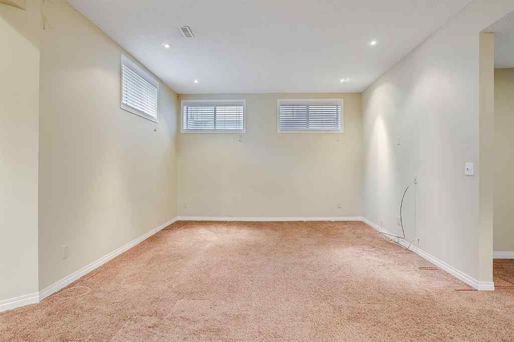 MLS® A2216232 - 596 Cougar Ridge Drive SW in Cougar Ridge Calgary, Residential