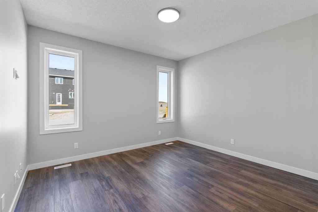 MLS® A2217676 - 65 Amblefield Heights NW in Moraine Calgary, Residential