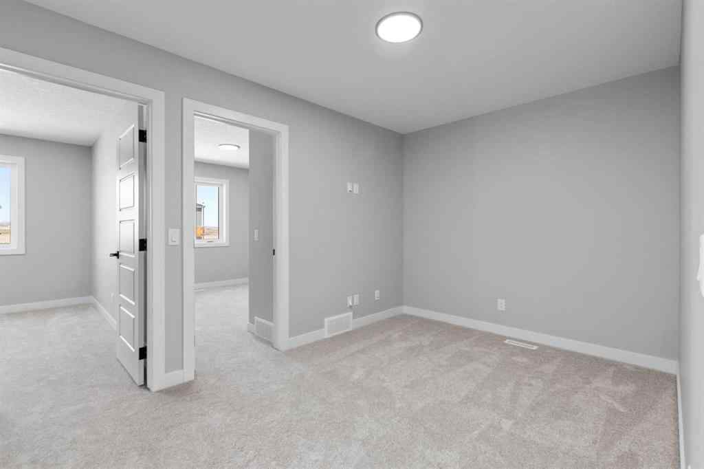 MLS® A2217676 - 65 Amblefield Heights NW in Moraine Calgary, Residential