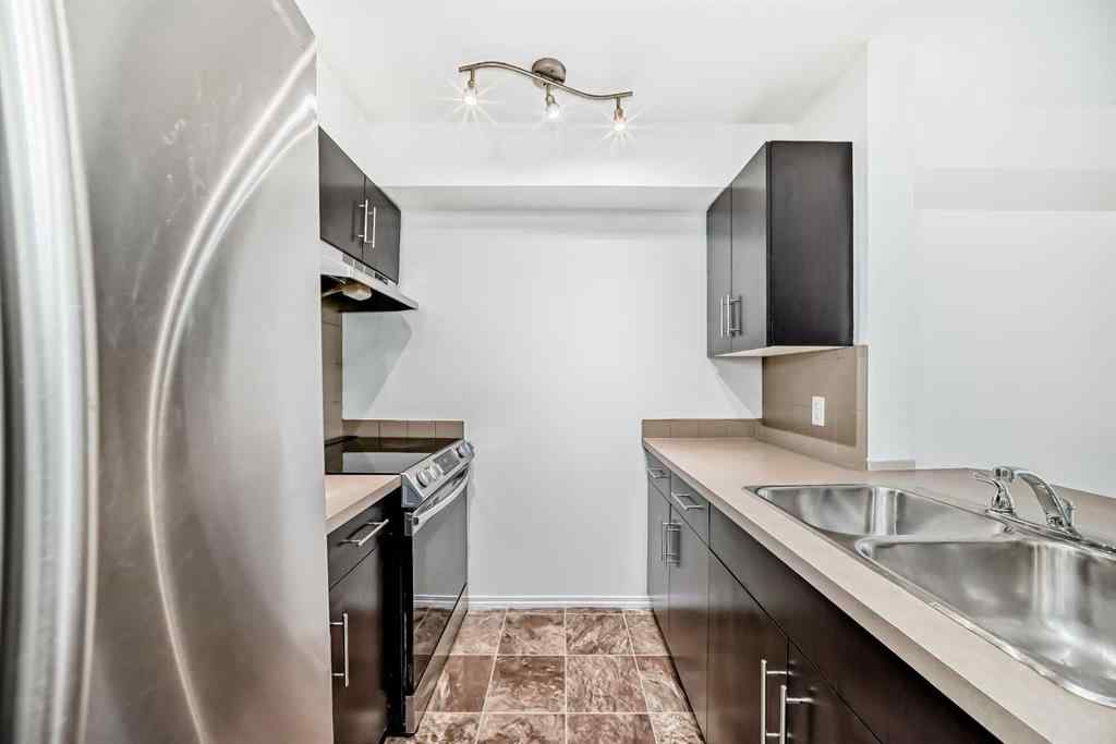 MLS® A2218066 - Unit #411 7130 80 Avenue NE in Saddle Ridge Calgary, Residential