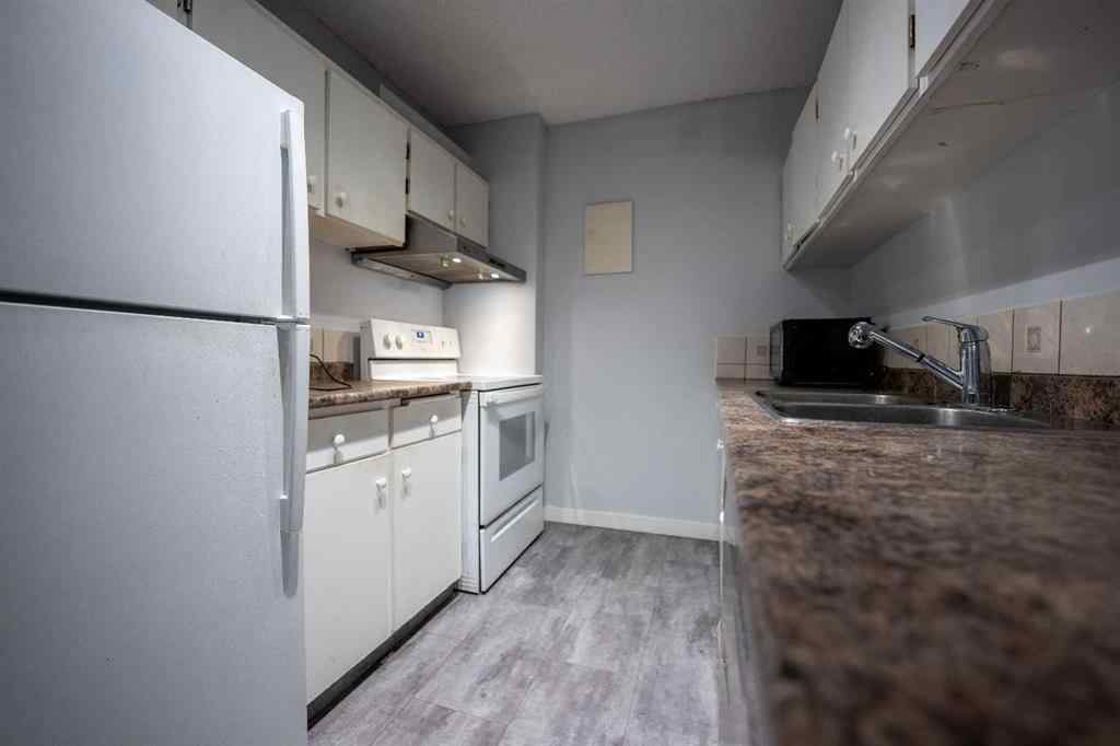 MLS® A2219979 - Unit #710 4944 Dalton Drive NW in Dalhousie Calgary, Residential