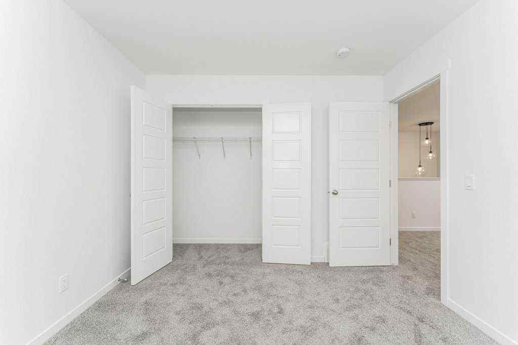 MLS® A2221582 - 68 Creekstone Grove SW in Pine Creek Calgary, Residential