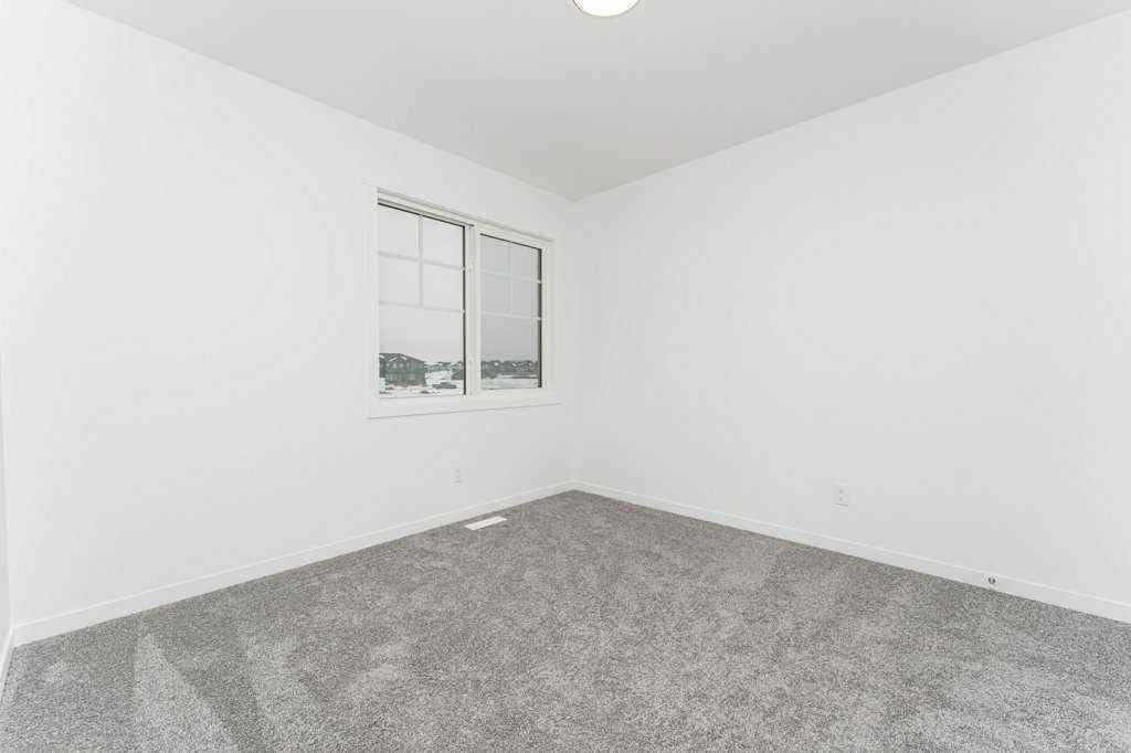 MLS® A2221582 - 68 Creekstone Grove SW in Pine Creek Calgary, Residential