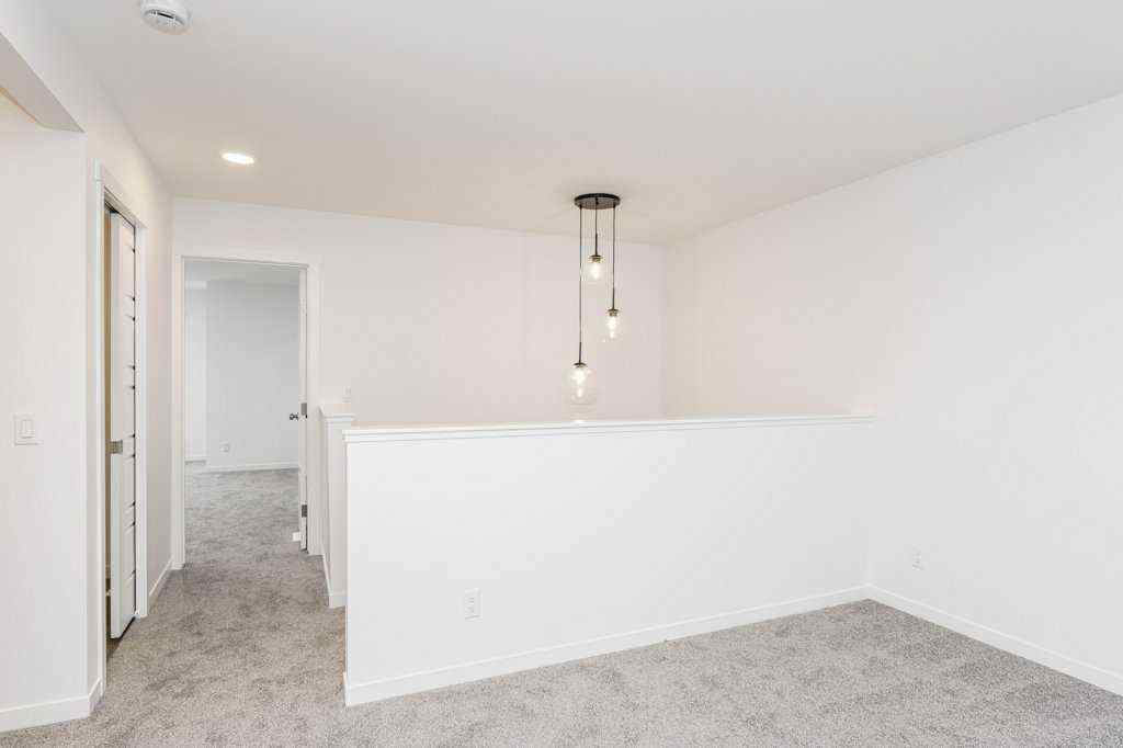 MLS® A2221582 - 68 Creekstone Grove SW in Pine Creek Calgary, Residential