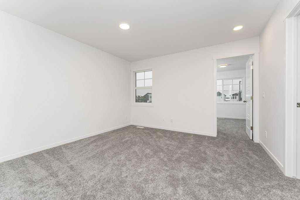 MLS® A2221582 - 68 Creekstone Grove SW in Pine Creek Calgary, Residential