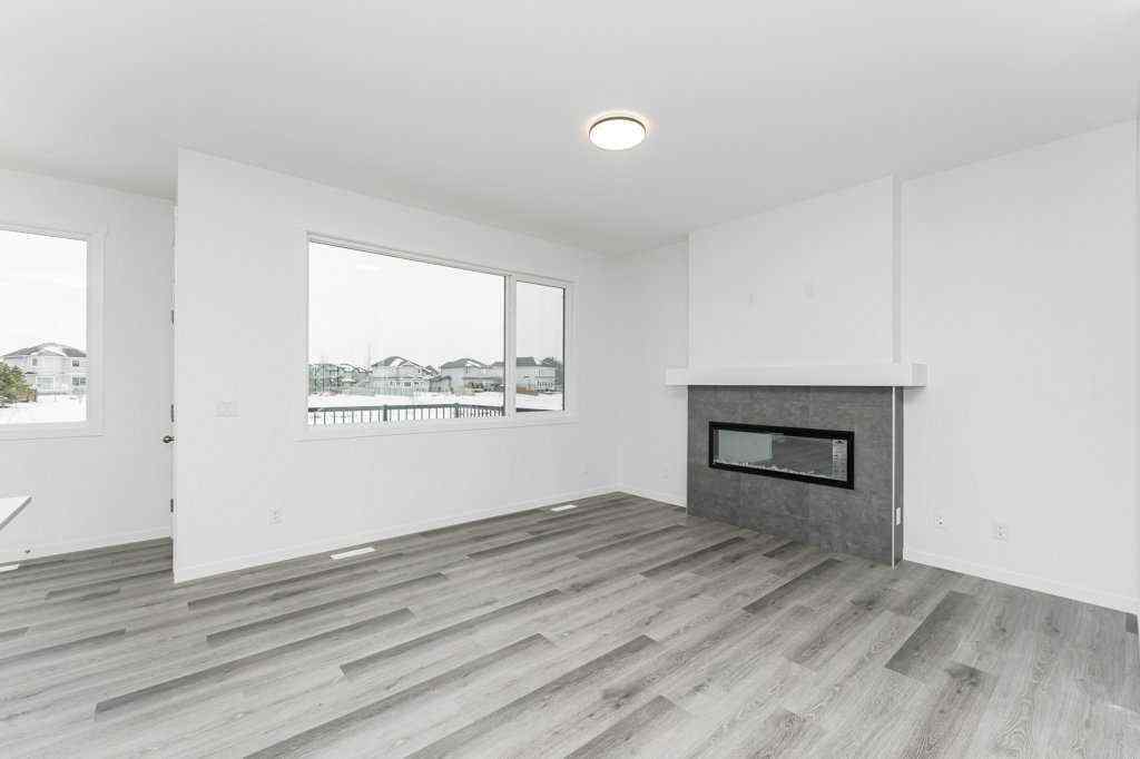 MLS® A2221582 - 68 Creekstone Grove SW in Pine Creek Calgary, Residential