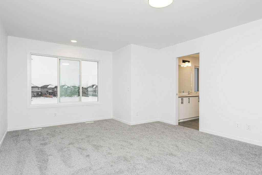 MLS® A2221582 - 68 Creekstone Grove SW in Pine Creek Calgary, Residential