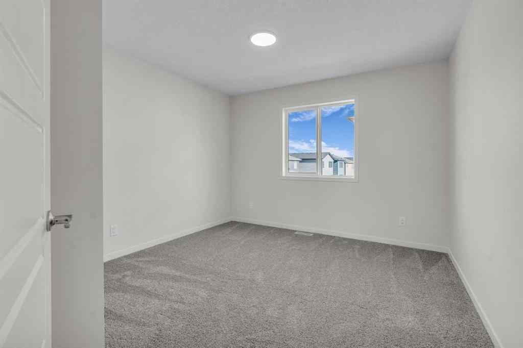 MLS® A2221944 - 83 Lucas Passage NW in Livingston Calgary, Residential