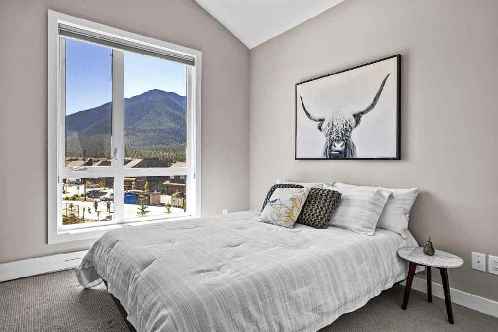 MLS® A2222314 - Unit #316 106 Stewart Creek Rise  in Three Sisters Canmore, Residential