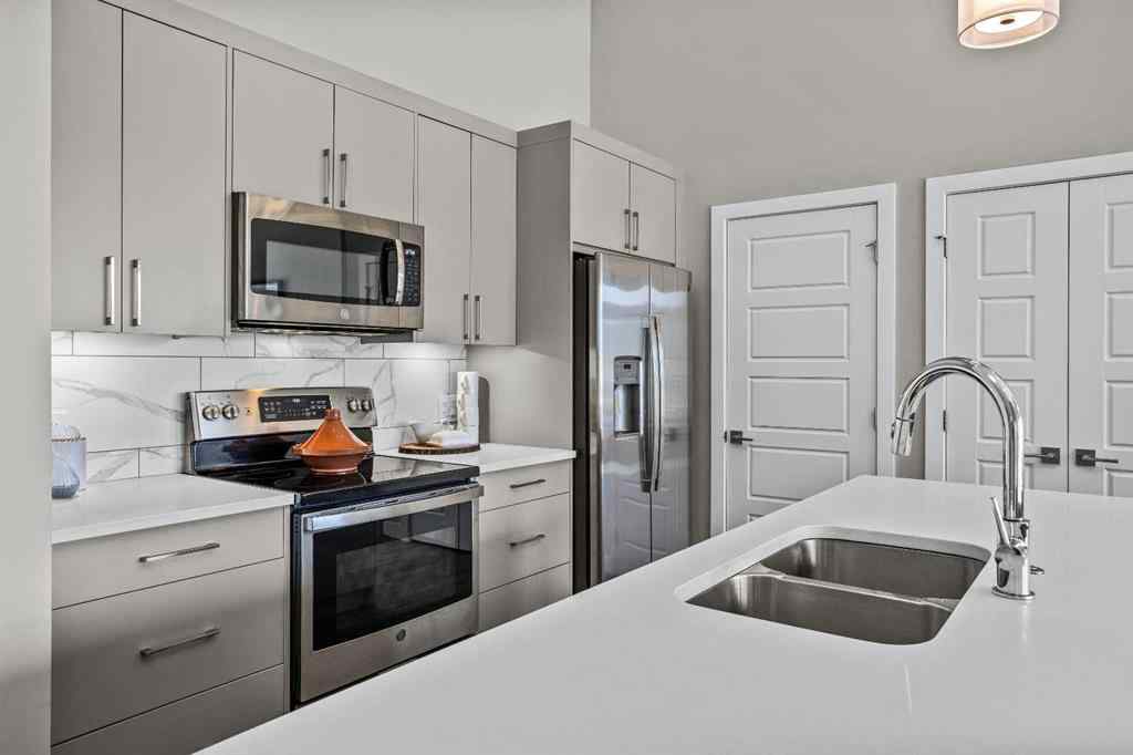 MLS® A2222314 - Unit #316 106 Stewart Creek Rise  in Three Sisters Canmore, Residential