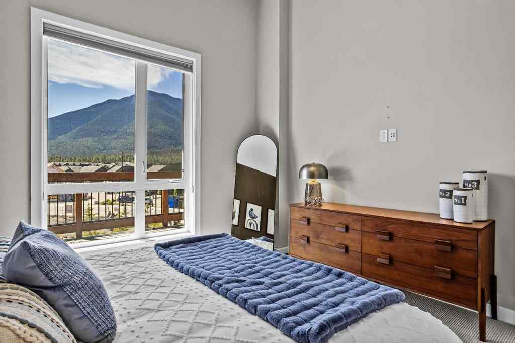 MLS® A2222314 - Unit #316 106 Stewart Creek Rise  in Three Sisters Canmore, Residential