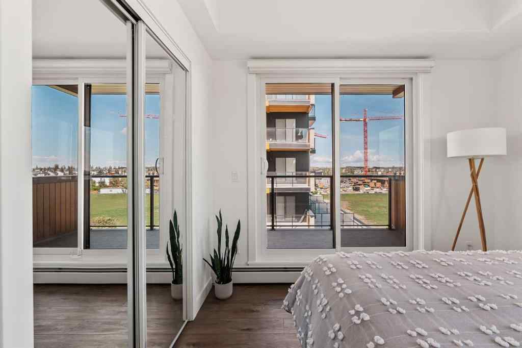 MLS® A2222901 - Unit #401 8230 Broadcast Avenue SW in West Springs Calgary, Residential