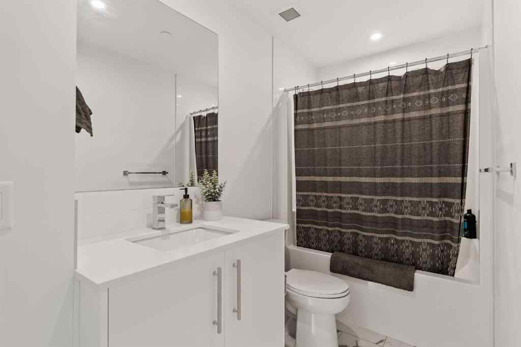 MLS® A2222901 - Unit #401 8230 Broadcast Avenue SW in West Springs Calgary, Residential
