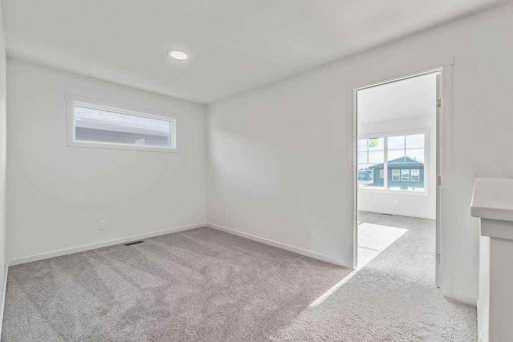 MLS® A2222964 - 838 Creekside Boulevard SW in Pine Creek Calgary, Residential