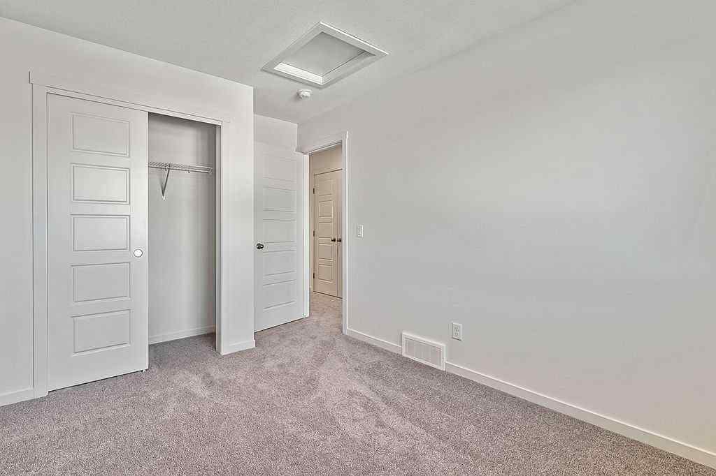 MLS® A2222964 - 838 Creekside Boulevard SW in Pine Creek Calgary, Residential