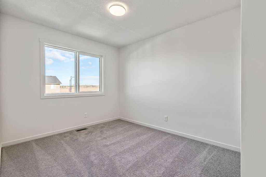 MLS® A2222964 - 838 Creekside Boulevard SW in Pine Creek Calgary, Residential