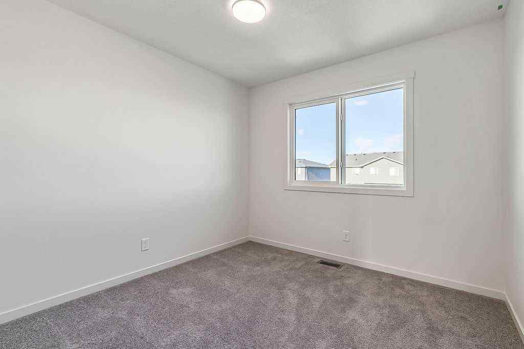 MLS® A2222964 - 838 Creekside Boulevard SW in Pine Creek Calgary, Residential