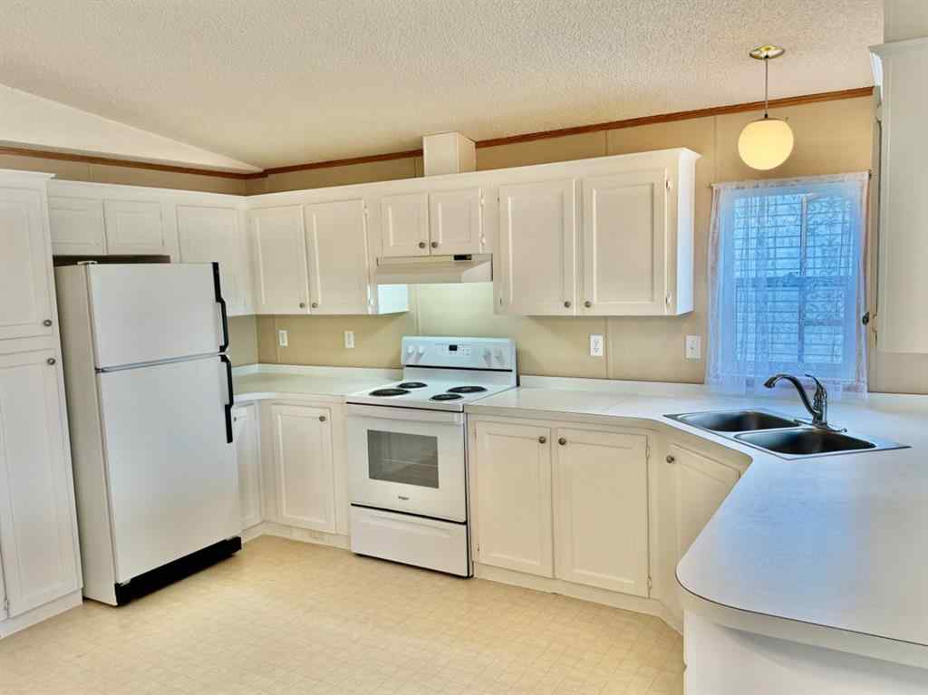 MLS® A2224376 - Unit #328 37543 England Way  in Waskasoo Estates Rural Red Deer County, Mobile