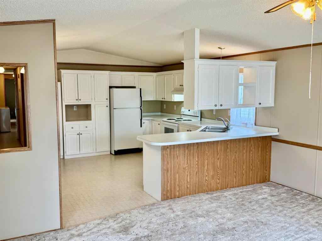 MLS® A2224376 - Unit #328 37543 England Way  in Waskasoo Estates Rural Red Deer County, Mobile