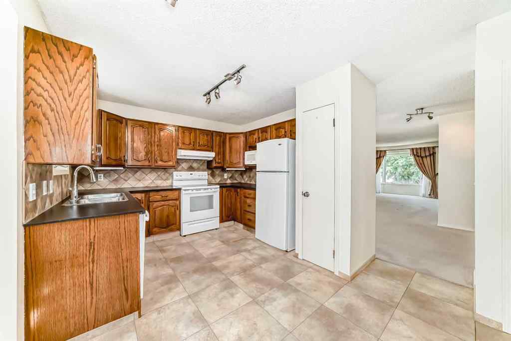 MLS® A2227257 - 139 Stratton Crescent SW in Strathcona Park Calgary, Residential