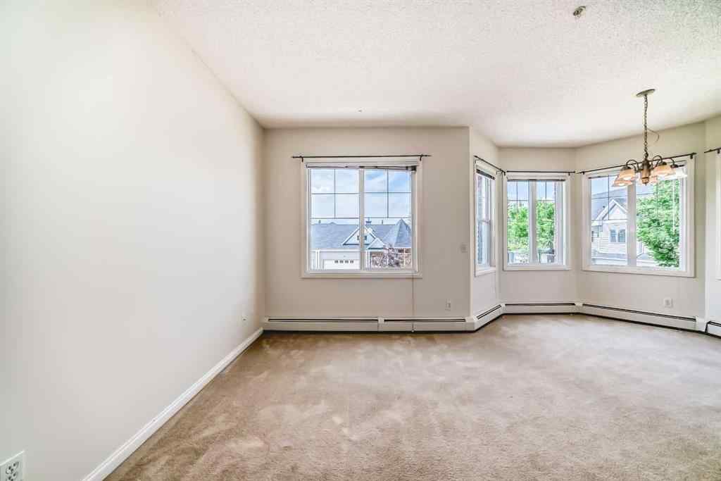 MLS® A2227287 - Unit #202 8 Prestwick Pond Terrace SE in McKenzie Towne Calgary, Residential