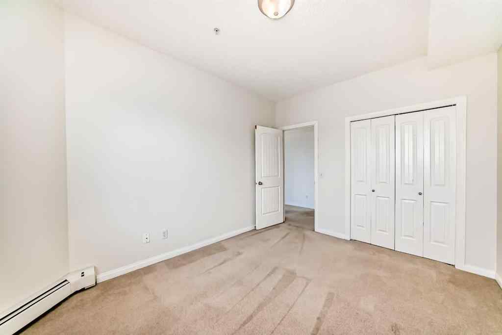 MLS® A2227287 - Unit #202 8 Prestwick Pond Terrace SE in McKenzie Towne Calgary, Residential
